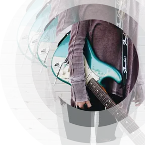 Someone holding a guitar under their arm